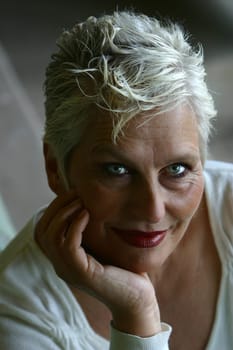 white-haired woman in her 50s