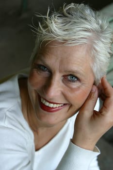 white-haired woman in her 50s