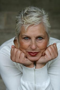 white-haired woman in her 50s