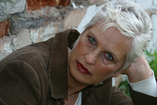 white-haired woman in her 50s