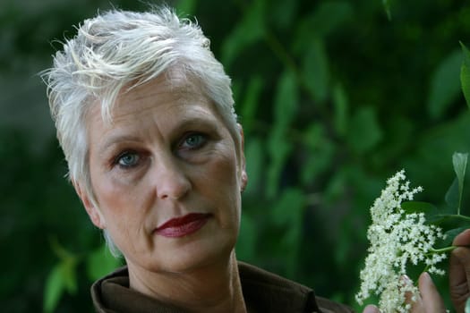 white-haired woman in her 50s