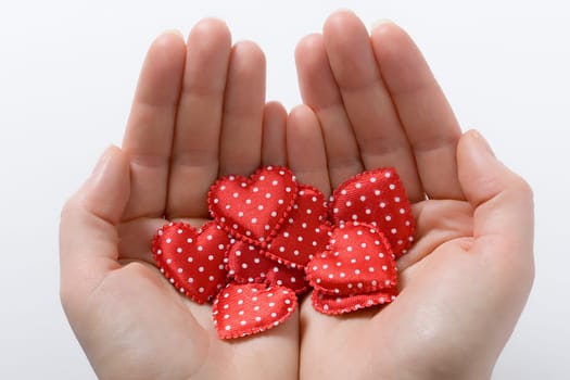 Hands with cloth hearts