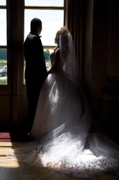 Bridal couple in backlight