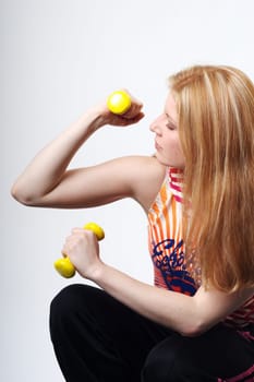 Franziska squatting with dumbbells