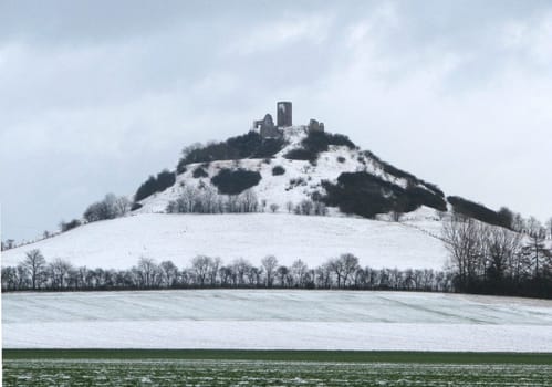 The Desenberg is the most prominent elevation of the Warburg Börde,a fertile and relatively flat basin in East Westphalia in the district of Höxter. It is a basalt dome crowned by a castle ruin and a testimony to the recent history of the earth,volcanism