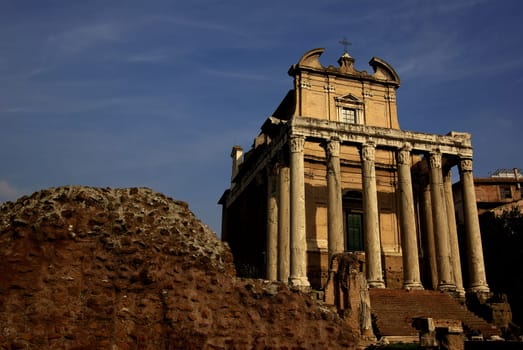 according to Wikipedia: The temple of Antoninus Pius and Faustina stands on the northern edge of the Roman Forum. It is one of the best preserved ancient temples in Rome. Emperor Antoninus Pius had the temple built in 141 AD for his deceased and