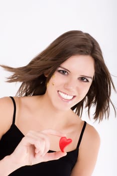 Young woman shows hearts