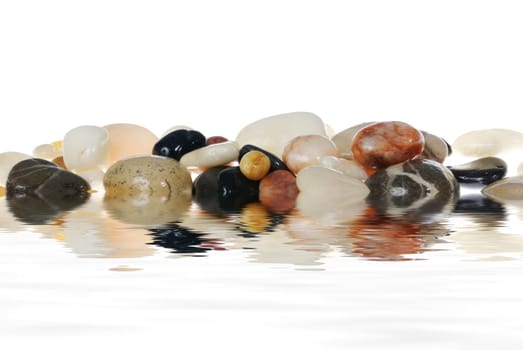 Painted stones are reflected in the water