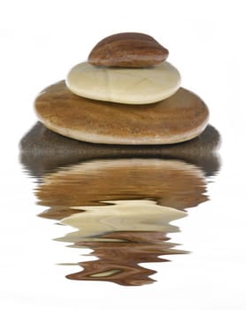Stack of stones reflected in the water