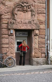 ATM in Weimar - note the grim mask at the top of the forest!