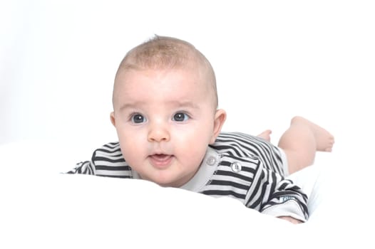 baby on white pillow