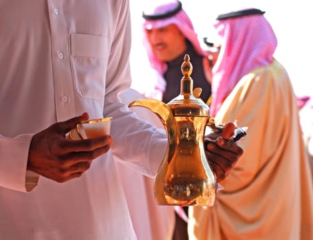 Saudi Arabian coffee is traditionally made from the bean shell rather than the bean and seasoned with ginger and often a lot of sugar,so the taste is more like tea than coffee. It is served in the typical Arabic coffee pot.