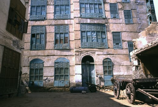 An old traditional house built of coral stone with wooden windows in the old town of Jeddah,Saudi Arabia.
