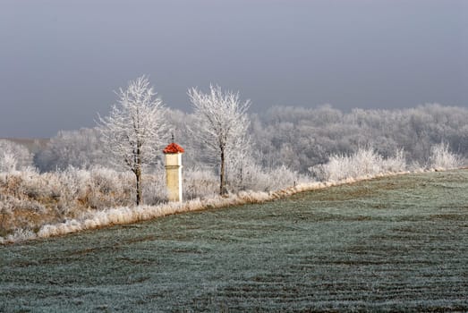 "Marterl"" (wayside shrine) in Lower Austria on a foggy December day,when the sun flashed through briefly."