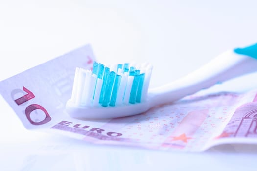 Toothbrush and 10 EURO