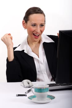 Laughing woman at the computer
