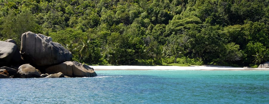 There is a small path in the north of the island that leads along the coast to Anse Georgette. However,this path is now almost completely overgrown and extremely difficult to find. By the way,the title is meant ironically  -) Almost