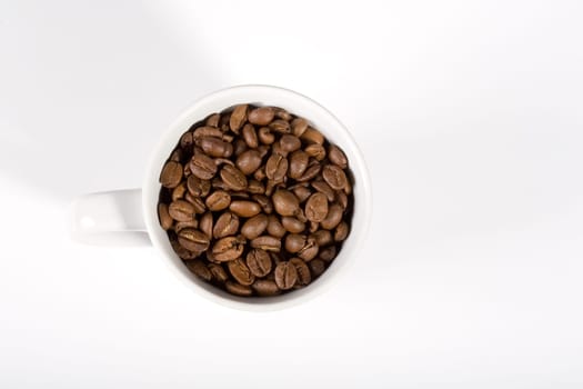 Cup full of coffee beans