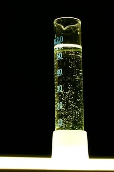 Measuring cylinder illuminated