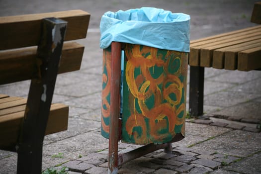 Decorated trash can in a city