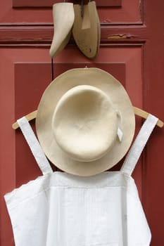 Hat and dress on hanger