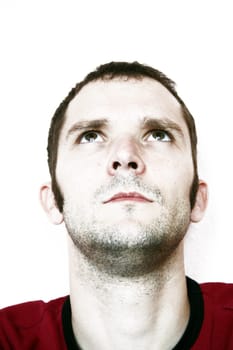 Man,unshaven,looking up