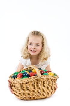 Girl with Easter eggs in basket