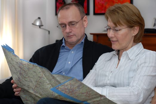 Middle-aged couple planning trip