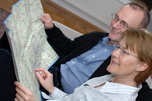 Middle-aged couple planning trip