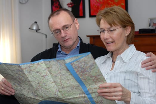 Middle-aged couple planning trip