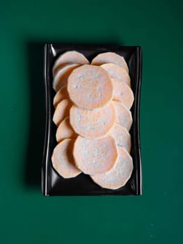 fresh and raw sweet potato slices. View from above. Chinese cuisine, ingredient for hotpot