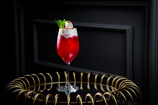 red cocktail on a dark background