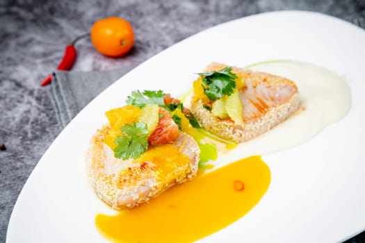 fish with tangerines, parsley and sesame breaded