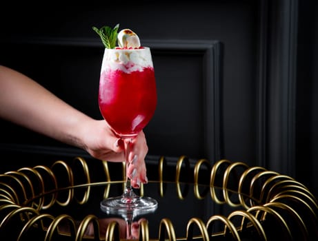 red cocktail on a dark background