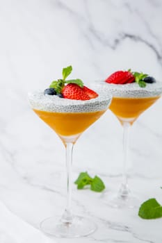exotic fruit cocktails with berries and chia seed topping and mint
