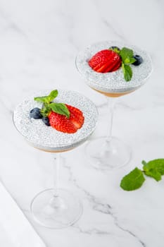 exotic fruit cocktails with berries and chia seed topping and mint