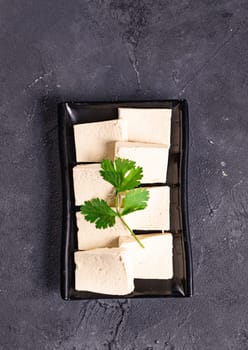 tofu slices with parsley on it