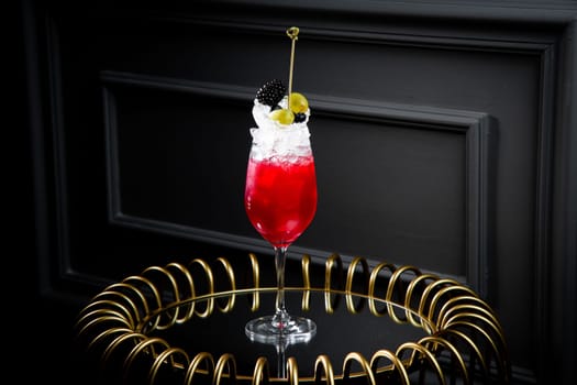 red cocktail on a dark background