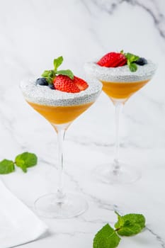 exotic fruit cocktails with berries and chia seed topping and mint