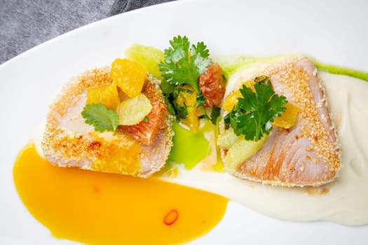 fish with tangerines, parsley and sesame breaded