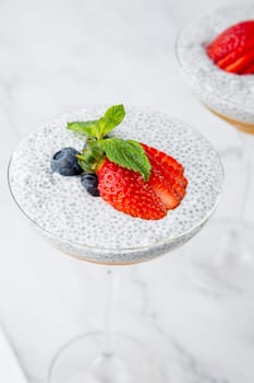 exotic fruit cocktails with berries and chia seed topping and mint