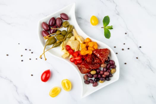 assorted nuts and dried vegetables on a light background