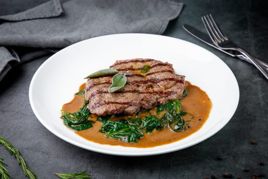 beef steak with gravy and herbs