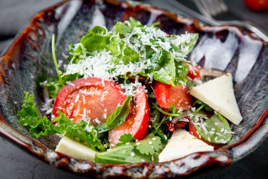 salad with tomatoes, feta cheese, lettuce and parsley