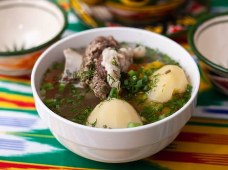 Surpa Soup from Boiled beef, potatoes and onions according to an oriental recipe. Eastern cuisine, national dish. High quality photo