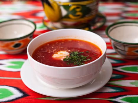 Borscht. Russian soup made from meat, beets, potatoes and served with sour cream. Asian style. High quality photo