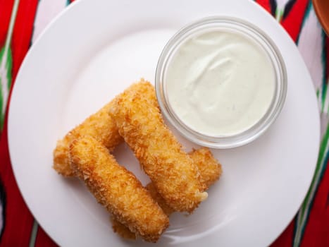 cheese sticks - fried breaded cheese served with creamy sauce. Asian style. High quality photo