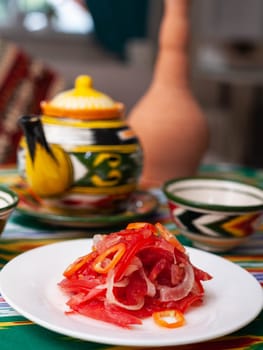 Salad of tomatoes and pickled onions according to the Uzbek recipe. Asian style. High quality photo