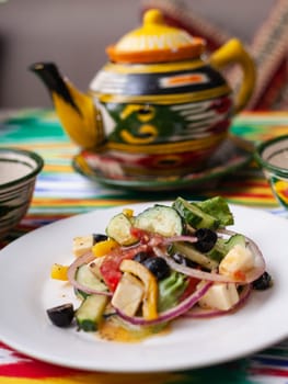 warm salad of green and red peppers, cheese, eggplants, onions and tomatoes Asian style. High quality photo