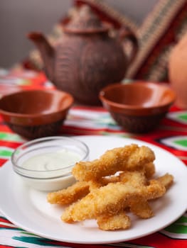 chicken nuggets - and breaded fried chicken served with a creamy sauce. Asian style. High quality photo